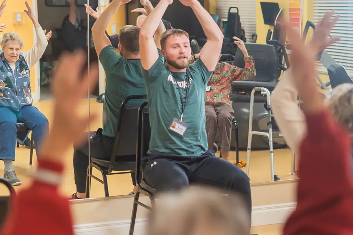 Residents participating in a senior fitness class with instructor at The Commons of Hilltop in Grand Junction
